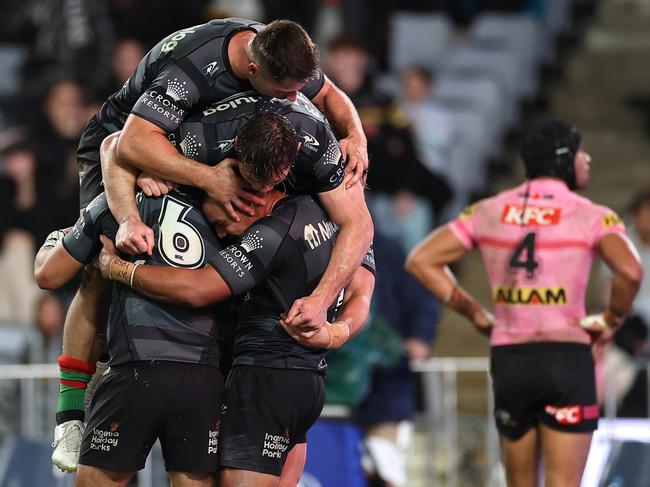 SYDNEY, AUSTRALIA - APRIL 20:  Isaiah Tass of the Rabbitohs celebrates with team mates after scoring a try during the round eight NRL match between South Sydney Rabbitohs and Penrith Panthers at Accor Stadium on April 20, 2023 in Sydney, Australia. (Photo by Cameron Spencer/Getty Images)