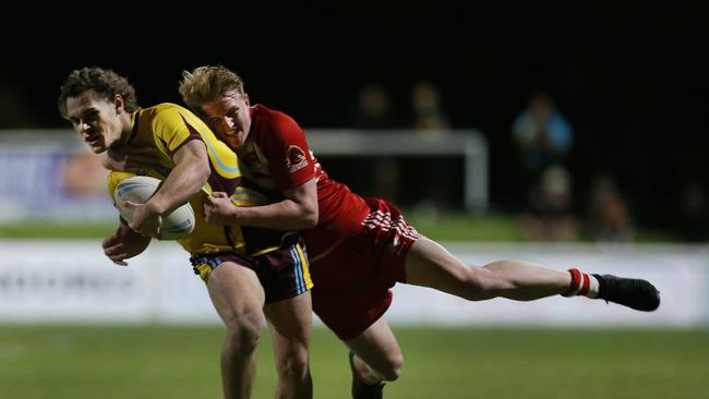 PBC’s Ryan Garner makes a tackle on Keebra’s Sebastian Winters-Chang in their match last year. Picture: Glenn Hampson