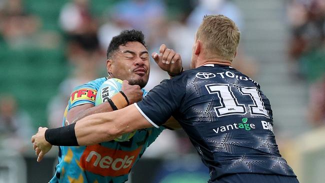 Greg Marzhew of the Titans is tackled by Coen Hess of the Cowboys during the NRL Nines 2020 tournament. Picture: AAP Image/Richard Wainwright