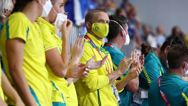 Cody Simpson applauds his girlfriend Emma McKeon as she receives her gold medal. Picture: Michael Klein