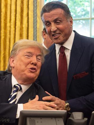 Donald Trump pardoned former world champion boxer Jack Johnson after a meeting with Sylvester Stallone (R). Picture: AFP