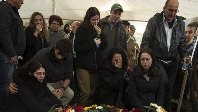 Family and friends mourn during a funeral for Captain Nir Binyamin, killed in a battle in South Gaza. Picture: Getty Images