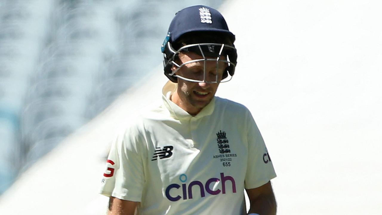 England's batsman Joe Root (R) reacts in pain after struck by a delivery from Australia's paceman Pat Cummins (not pictured) on day three of the third Ashes cricket Test match between Australia and England in Melbourne on December 28, 2021. (Photo by Hamish Blair / AFP) / -- IMAGE RESTRICTED TO EDITORIAL USE - STRICTLY NO COMMERCIAL USE --