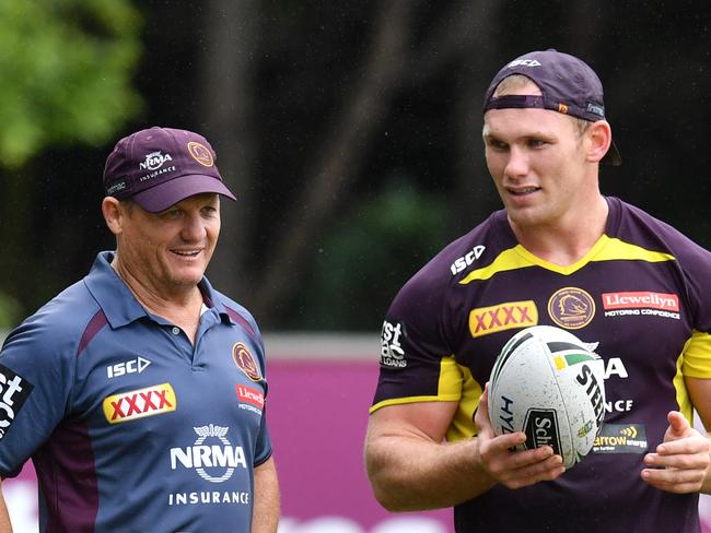 Assistant coach Kevin Walters (left) is seen with Matt Lodge (right) during a Brisbane Broncos training session at Clive Berghofer Field in Brisbane, Wednesday, March 7, 2018. The Broncos play the St George-Illawarra Dragons in the opening match of the 2018 NRL season on Thursday night in Sydney. (AAP Image/Darren England) NO ARCHIVING