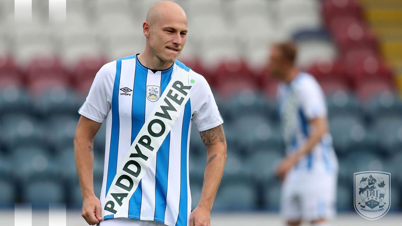 Huddersfield have been charged by FA for wearing their controversial Paddy Power kit
