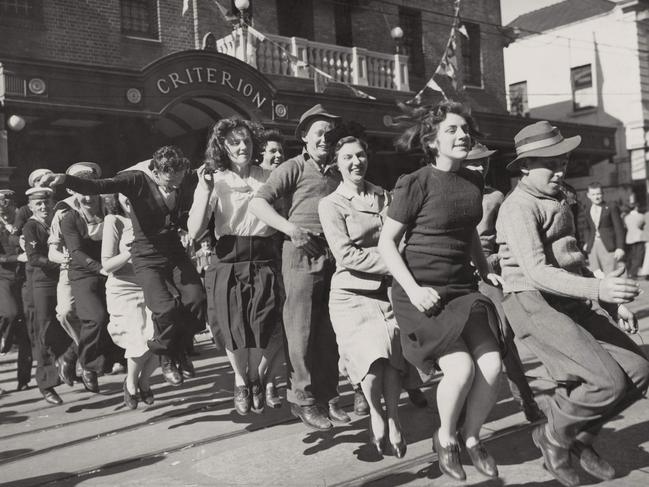 People took to the streets in Brisbane and across the nation to celebrate Victory in Pacific Day on August 15, 1945. Picture: Australian War Memorial