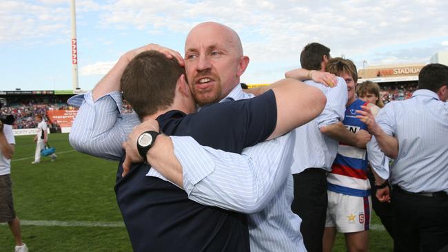 Laird celebrates the 2010 premiership win against Norwood at AAMI Stadium.