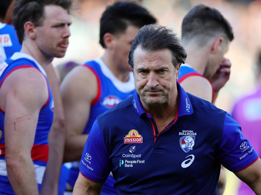 Luke Beveridge walks away from the Western Bulldogs’ huddle against Port Adelaide on Saturday. Picture: Sarah Reed/AFL Photos via Getty Images.