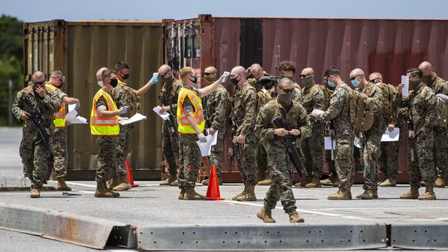 Marines disembarking from a flight in Okinawa, Japan, where they will undergo 14 days of quarantine before making they make their way to Darwin. Picture: MRF-D, Twitter.