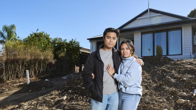 Gian David with his partner, Rizelle Fontelar at their home in Adelaide’s south, where they are 15k out of pocket after Adelaide Exposed Concrete went bust. Picture: Matt Loxton