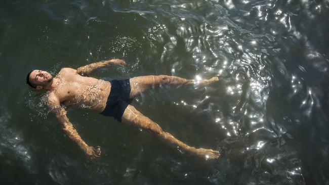 Moulay Bekkali cools off at Elwood beach. Picture: Eugene Hyland