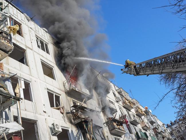 Ukrainian firefighters try to extinguish a fire after an air strike hit an apartment complex in Chuhuiv, Kharkiv Oblast. Picture: Wolfgang Schwan/Anadolu Agency via Getty Images