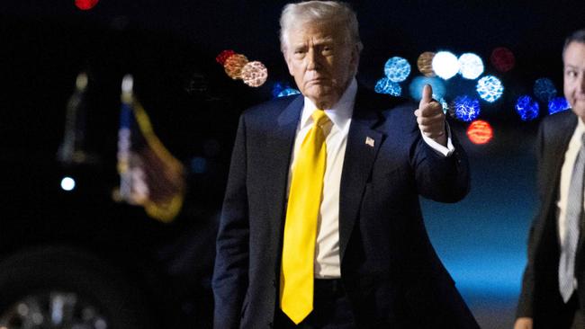 US President Donald Trump gives a thumb's up after stepping off Air Force One at Palm Beach International Airport in West Palm Beach, Florida, on March 7, 2025. Trump is spending the weekend at his Mar-a-Lago resort. (Photo by ROBERTO SCHMIDT / AFP)