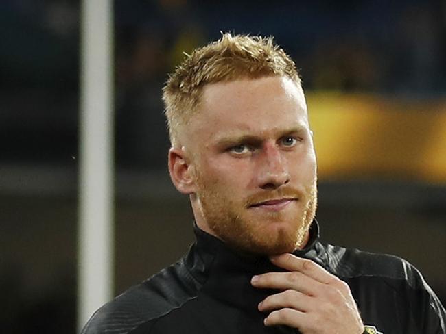 MELBOURNE, AUSTRALIA - MARCH 18: Nick Vlastuin of the Tigers leaves the field with a leg injury after a win during the 2021 AFL Round 01 match between the Richmond Tigers and the Carlton Blues at the Melbourne Cricket Ground on March 18, 2021 in Melbourne, Australia. (Photo by Dylan Burns/AFL Photos via Getty Images)