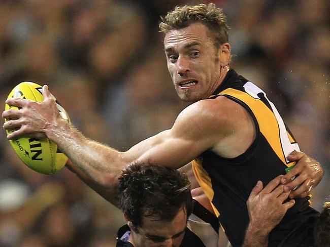 20 JULY 2020 - Former AFL footballer Shane Tuck has died at the age of 38. Tuck played 173 matches for the Richmond Tigers between 2004 and 2013. MELBOURNE, AUSTRALIA - APRIL 07:  Shane Tuck of the Tigers tries to break free during the round two AFL match between the Collingwood Magpies and the Richmond Tigers at the Melbourne Cricket Ground on April 7, 2012 in Melbourne, Australia.  (Photo by Hamish Blair/Getty Images)