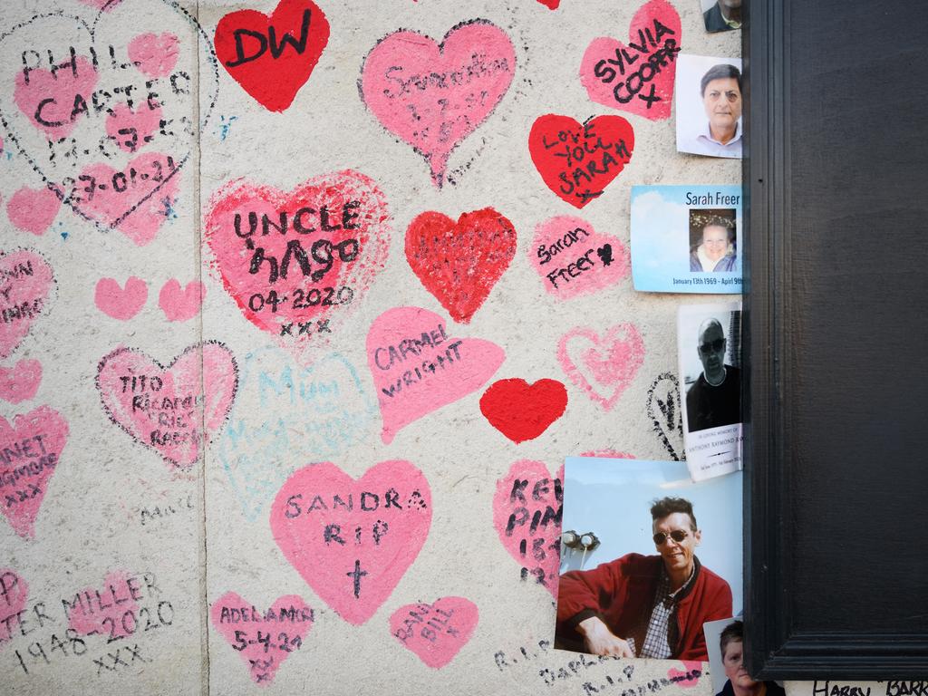 Personal messages and photographs of those who died of Covid-19 are seen on the National Covid Memorial wall, opposite the Houses of Parliament in London. Picture: Getty Images