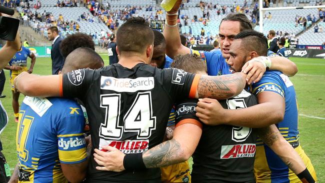 Players from both teams pray after the Round 4 NRL game between the Wests Tigers and the Parramatta Eels at ANZ Stadium.Picture Gregg Porteous