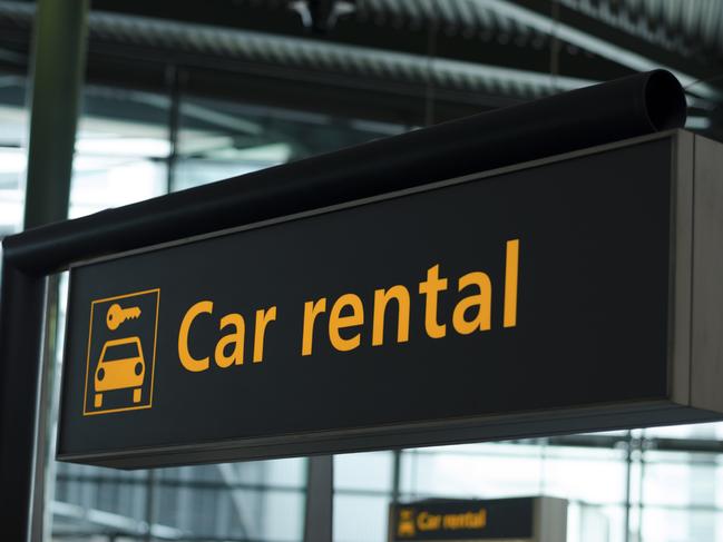 Generic photo of a car rental sign at an airport