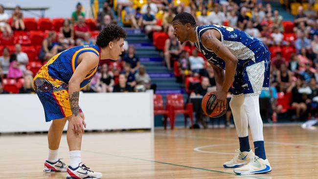 Fred Williams from Ansett faces up against William Burton from the Jets. Darwin Basketball Men's Championship Round 20: Ansett v Tracy Village Jets. Picture: Che Chorley