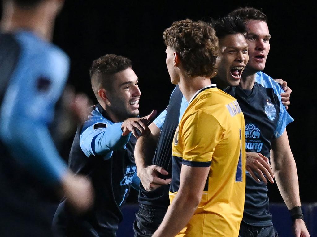 Buriram United players (in blue) celebrate a goal during the AFC Champions League Elite football match between Australiaâ€™s Central Coast Mariners and Thailandâ€™s Buriram United at Central Coast Stadium in Gosford on October 1, 2024. (Photo by Saeed KHAN / AFP) / -- IMAGE RESTRICTED TO EDITORIAL USE - STRICTLY NO COMMERCIAL USE --