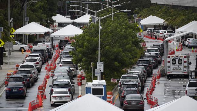 Cars queue outside a mobile COVID-19 testing site at the Miami Beach Convention Centre on Florida on Monday. Picture: AFP