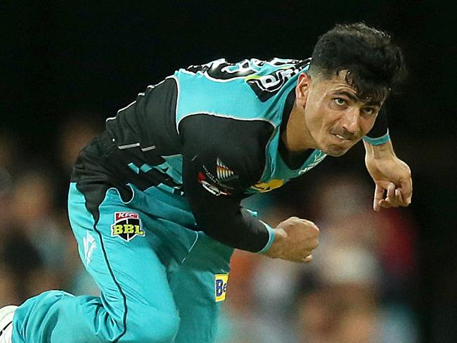 Mujeeb Ur Rahman of the Heat bowls the ball during the Big Bash League (BBL) match between Brisbane Heat and the Adelaide Strikers at The Gabba, in Brisbane, Wednesday, December 19, 2018. (AAP Image/Jono Searle) NO ARCHIVING, EDITORIAL USE ONLY, IMAGES TO BE USED FOR NEWS REPORTING PURPOSES ONLY, NO COMMERCIAL USE WHATSOEVER, NO USE IN BOOKS WITHOUT PRIOR WRITTEN CONSENT FROM AAP