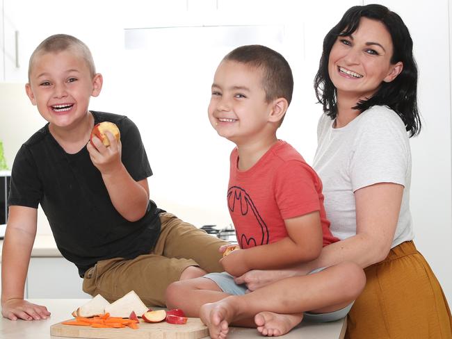 Mother Hayley Ibbotson on the NSW Central Coast, with sons Asher Stewart, 6, and Levi Stewart, 4. Picture: Sue Graham.