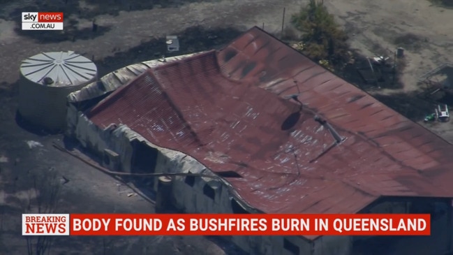 Body found as bushfires burn out of control in Queensland