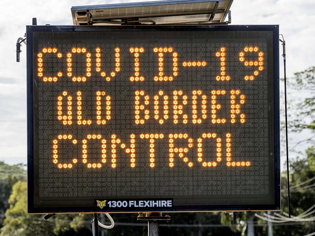 A road sign warning motorists of the COVID-19 QLD Border control by Queensland police enforcing the QLD state border closer due to Coronavirus (COVID-19) and checking drivers as they cross from NSW to QLD at Gold Coast Highway at Bilinga. . Picture: Jerad Williams