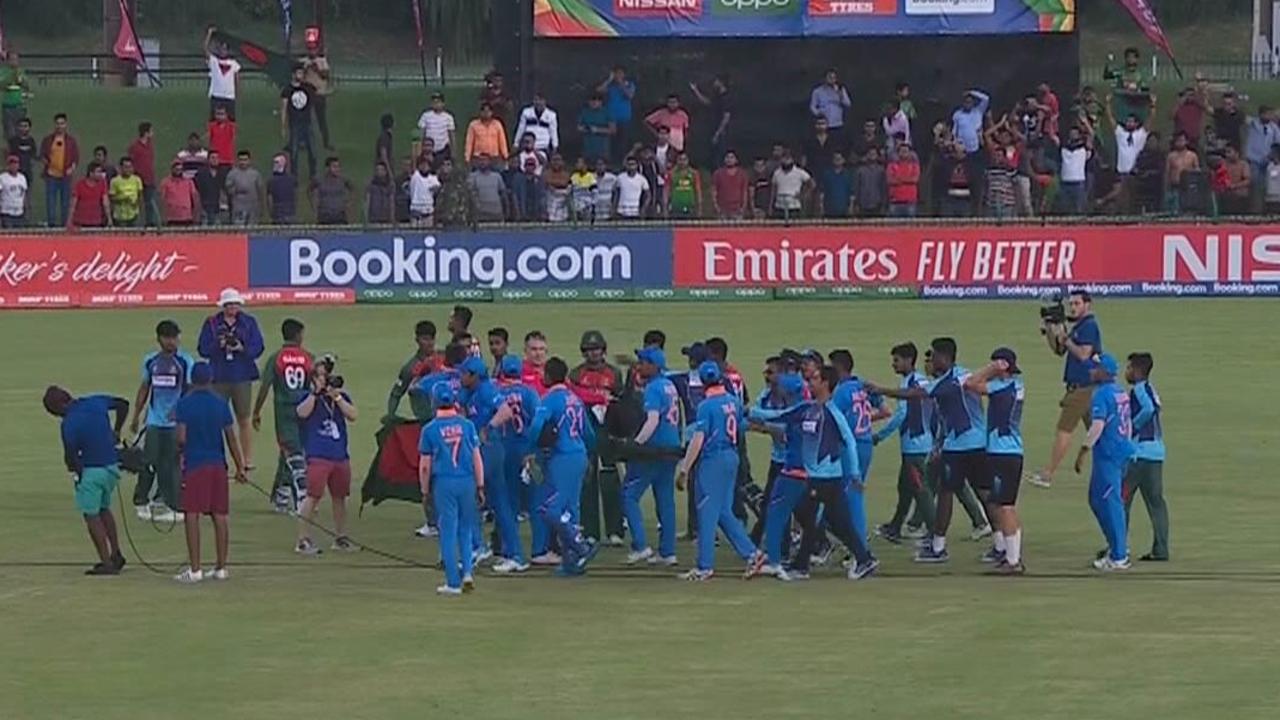 Bangladesh and India's players clash after the match.