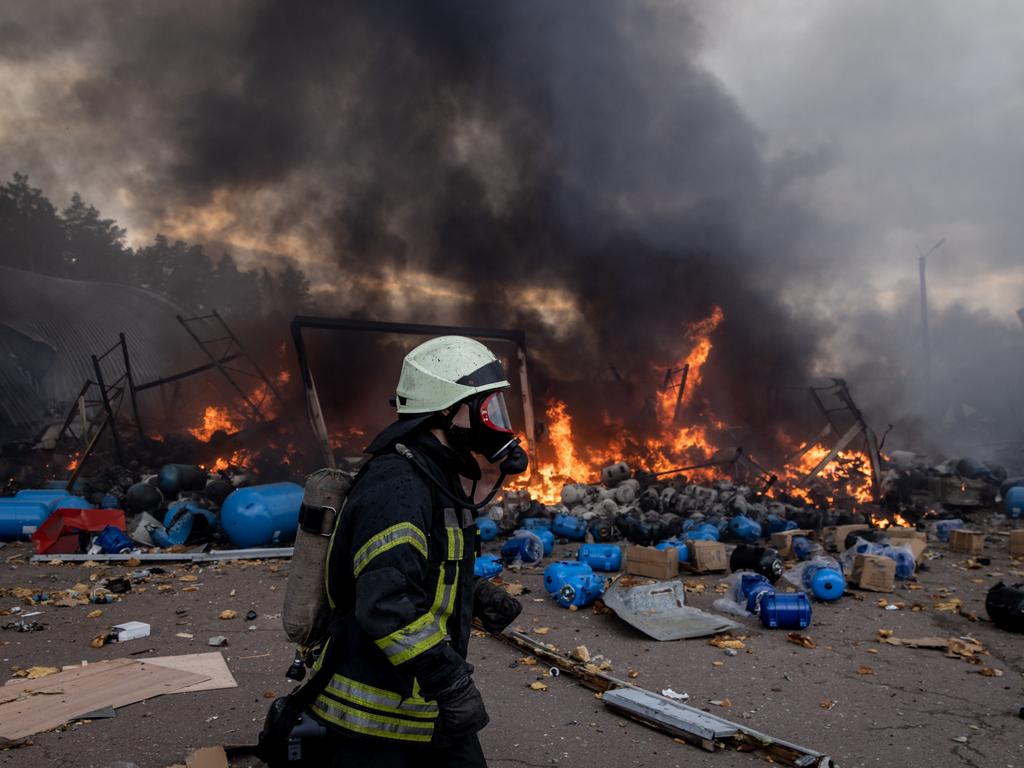 Firefighters try to extinguish a fire after a chemical warehouse was hit by Russian shelling on the eastern frontline near Kalynivka village in Kyiv, Ukraine. Picture: Getty