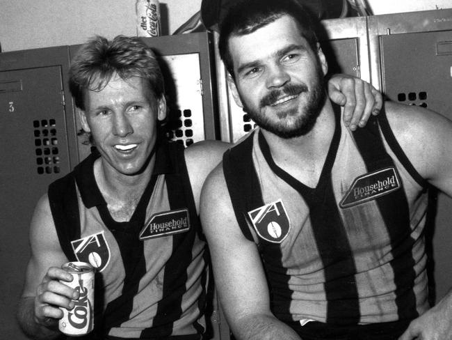 Hawthorn players Andy Collins and Jason Dunstall take in a refreshing, healthy Diet Coke post-match in 1990.