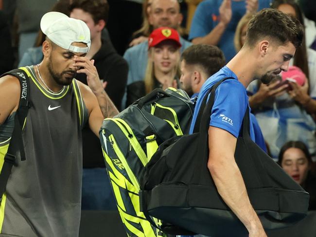 MELBOURNE, AUSTRALIA - JANUARY 16: Nick Kyrgios and Thanasi Kokkinakis of Australia look dejected as they leave John Cain Arena after retiring in the Men's Doubles First Round match against James Duckworth and Aleksandar Vukic of Australia during day five of the 2025 Australian Open at Melbourne Park on January 16, 2025 in Melbourne, Australia. (Photo by Cameron Spencer/Getty Images)