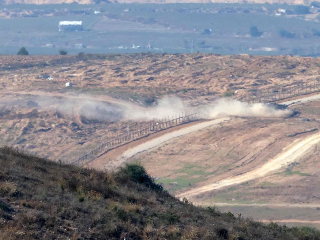 An Israeli tank crossing back into Israel from Gaza. Picture: AFP