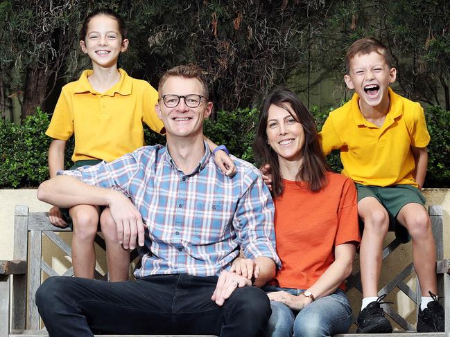 Author Joel Gibson, his wife Louise and children Frankie, 9, and Jack, 7. Picture: Tim Hunter