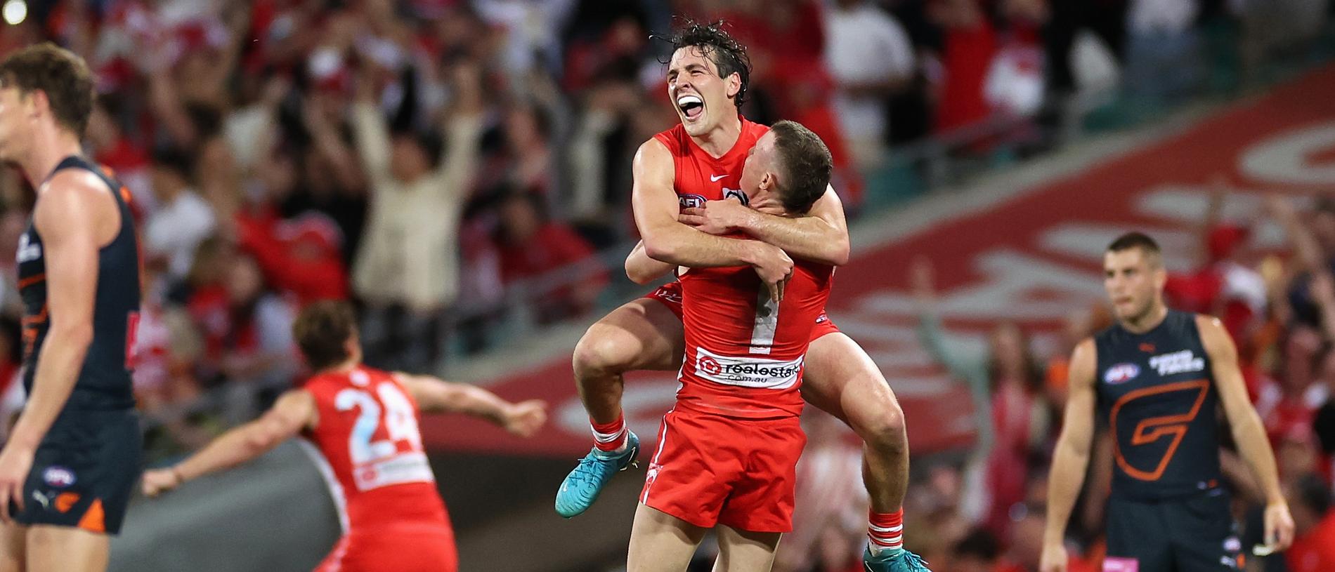 SYDNEY, AUSTRALIA - SEPTEMBER 07: Errol Gulden of the Swans and Chad Warner of the Swans celebrate winning the AFL First Qualifying Final match between Sydney Swans and Greater Western Sydney Giants at Sydney Cricket Ground, on September 07, 2024, in Sydney, Australia. (Photo by Cameron Spencer/Getty Images)