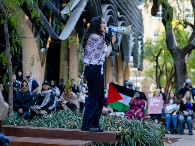 A protester rallies the crowd. Picture: Jason Edwards