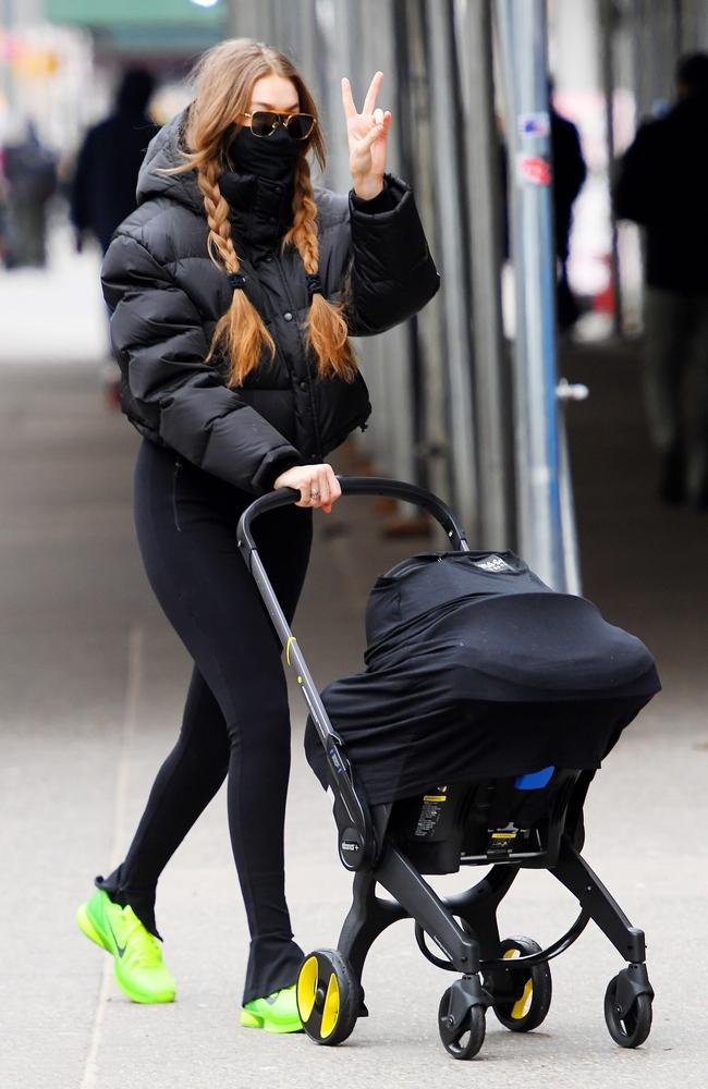 A masked up Hadid takes her baby out for a stroll. Picture: Backgrid