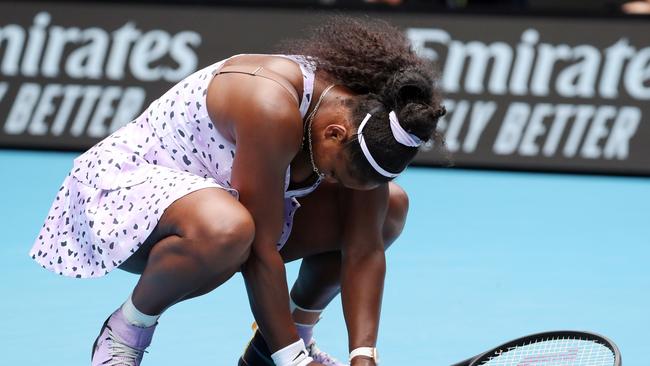 A dejected Serena Williams reacts after losing a point to Wang Qiang on Friday.