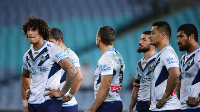 SYDNEY, AUSTRALIA — AUGUST 17: Kevin Proctor of the Titans (L) and team mates look dejected after an Eels try during the round 24 NRL match between the Parramatta Eels and the Gold Coast Titans at ANZ Stadium on August 17, 2017 in Sydney, Australia. (Photo by Matt King/Getty Images)