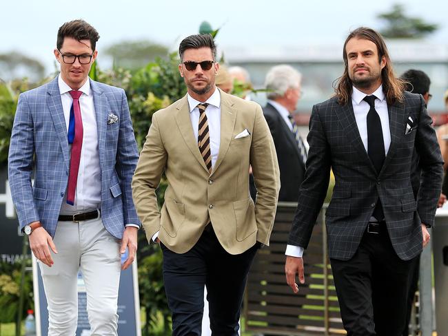 Former <i>Bachelor</i> and new father Sam Wood (centre) appears at the Caulfield Cup. Picture: Mark Stewart