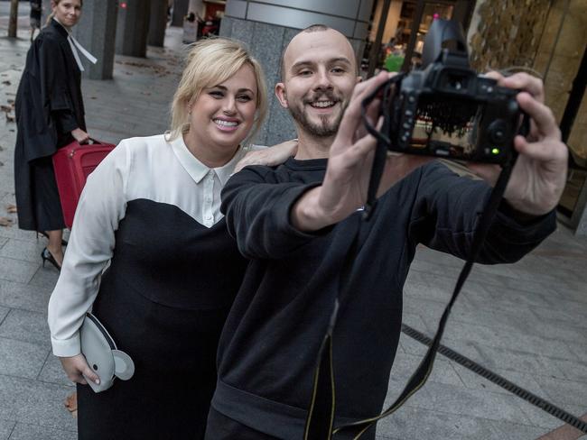 A fan stops Wilson for a selfie outside court. Picture: Jake Nowakowski