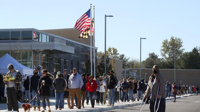 People wait in line to cast their votes at a polling booth in Owings, Maryland. Picture: Getty Images