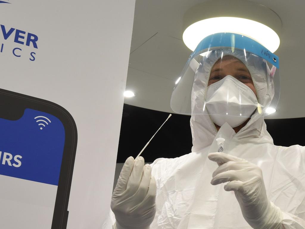 Health personnel poses with a testing tube at the new Lufthansa coronavirus test centre of the Franz-Josef-Strauss airport in Munich, southern Germany. Picture: AFP