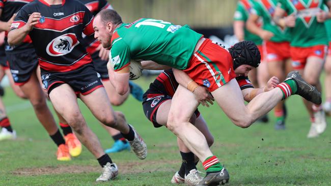 Mitchell Swadling is well tackled for the Corrimal Cougars 1st Division. Picture: Steve Montgomery | OurFootyTeam