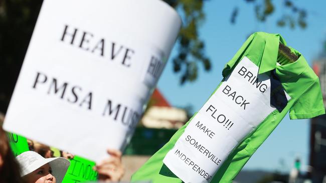 Protesters held signs and dressed in Somerville House colours during the rally. Picture: Claudia Baxter/AAP