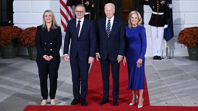 US President Joe Biden (2nd R), First Lady Jill Biden (R), Australia's Prime Minister Anthony Albanese (2nd L) and Jodie Haydon (L) pose for pictures at the South Portico of the White House in Washington, DC this morning.