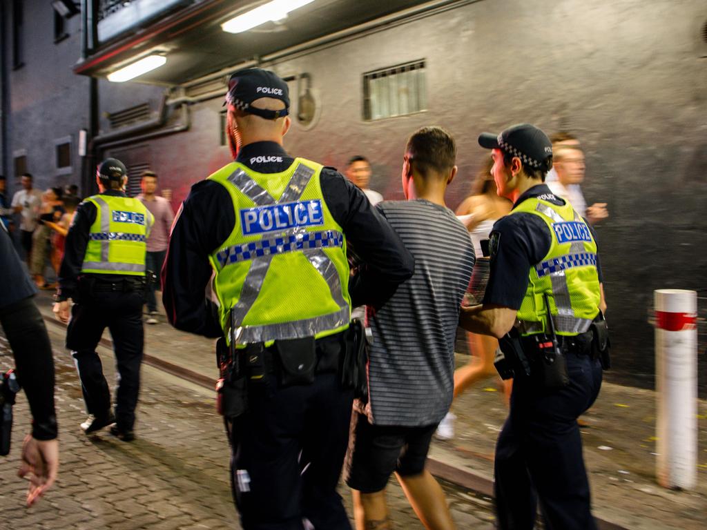 Police arrest a man in Hindley St just after midnight, New Year’s Day, 2020. Picture: AAP / Morgan Sette