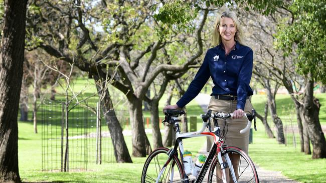 Tour Down Under women's race director Kimberley Conte poses with her bike at Rymill Park, Adelaide, Saturday, September 8th, 2018. Kimberley reveals the 2019 Tour Down Under women's race route today. (AAP Image / Bianca De Marchi)