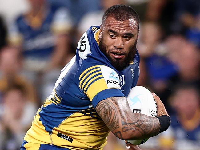 SYDNEY, AUSTRALIA - MAY 07:  Junior Paulo of the Eels is tackled during the round nine NRL match between the Parramatta Eels and the Sydney Roosters at Bankwest Stadium on May 07, 2021, in Sydney, Australia. (Photo by Cameron Spencer/Getty Images)